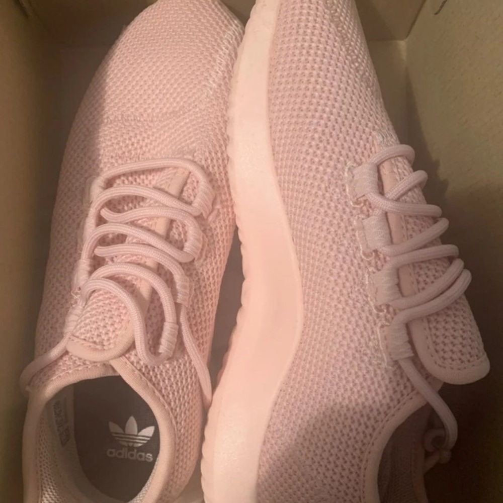 Pink adidas sneakers.